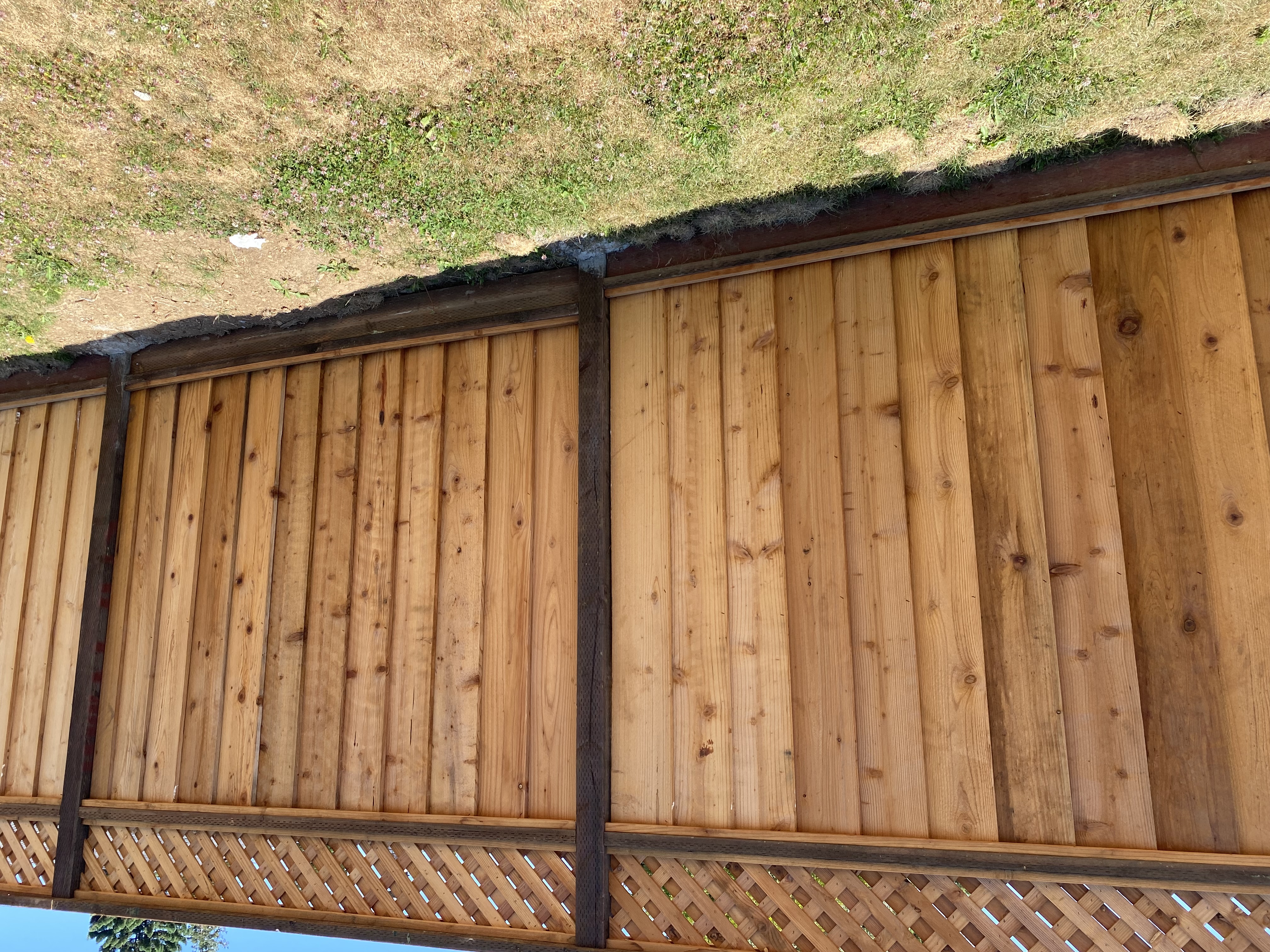 Vertical cedar fence with lattice detail