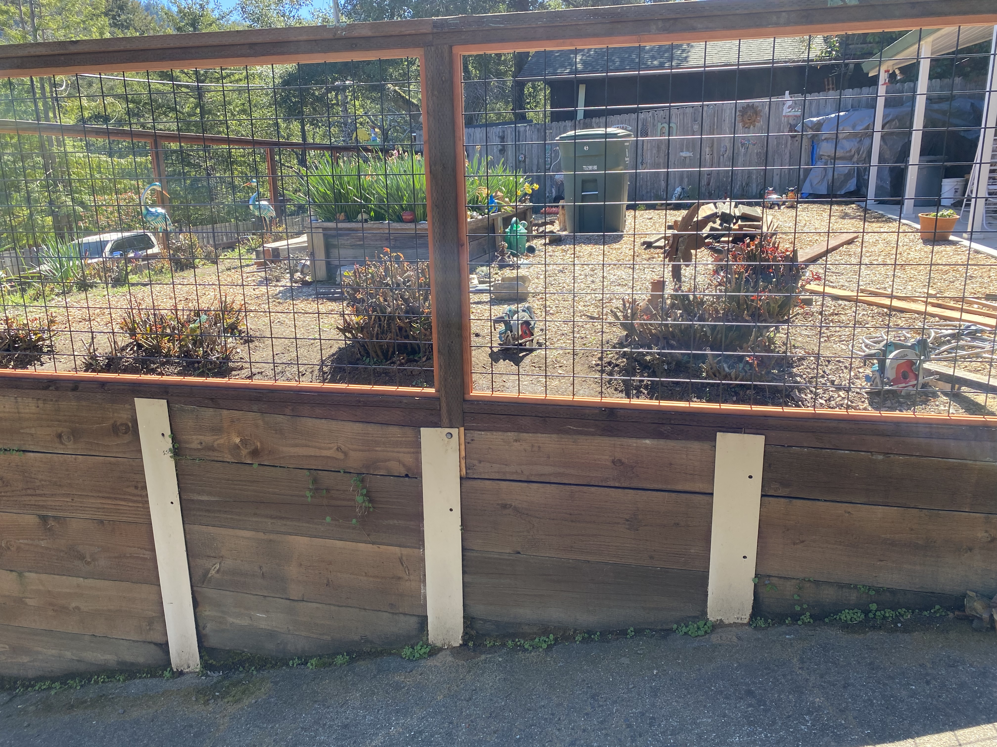 Hog wire and wood fence